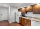 Functional kitchen features wooden cabinets, modern appliances, and practical design at 4206 Pinehurst Circle # E8, Little River, SC 29566