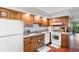 Charming kitchen equipped with appliances, ample storage, and stylish flooring at 4206 Pinehurst Circle # E8, Little River, SC 29566