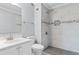 Updated bathroom features a sleek, glass-enclosed shower, modern vanity, and mosaic tile accents at 4350 Intercoastal Dr. # 2408, Little River, SC 29566