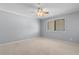 Neutral bedroom offers a ceiling fan and natural light from the window with blinds at 4350 Intercoastal Dr. # 2408, Little River, SC 29566