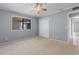 Cozy bedroom features natural light, ceiling fan, and spacious closet at 4350 Intercoastal Dr. # 2408, Little River, SC 29566