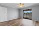Bedroom featuring hardwood floors, ceiling fan, and sliding glass doors at 4350 Intercoastal Dr. # 2408, Little River, SC 29566