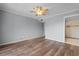 Spacious bedroom with hardwood floors and ensuite bathroom at 4350 Intercoastal Dr. # 2408, Little River, SC 29566