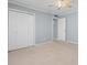Neutral bedroom has a ceiling fan, closet, and doorway to the hall at 4350 Intercoastal Dr. # 2408, Little River, SC 29566