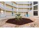 Beautiful courtyard with central garden and seating areas, perfect for relaxation and enjoying the outdoors at 4350 Intercoastal Dr. # 2408, Little River, SC 29566