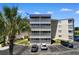 Exterior showcasing the top condo unit with screened-in porch and parking at 4350 Intercoastal Dr. # 2408, Little River, SC 29566