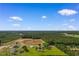 Scenic aerial view of the property, highlighting the house, acreage, and surrounding landscape at 4499 Highway 308, Aynor, SC 29544