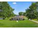 Beautiful aerial view of the property showcasing the house, barn, driveway and surrounding acreage at 4499 Highway 308, Aynor, SC 29544