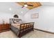 Bedroom with vaulted ceiling, hardwood floors, ceiling fan, and queen bed at 4499 Highway 308, Aynor, SC 29544