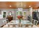 Elegant dining room showcasing a chandelier, dark wood accents, with beautiful natural light and hardwood flooring at 4499 Highway 308, Aynor, SC 29544
