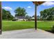 Charming exterior view of a white farmhouse with a long driveway and well-manicured lawn at 4499 Highway 308, Aynor, SC 29544
