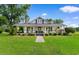 Charming single-story home featuring a large front porch with swing and well-manicured lawn at 4499 Highway 308, Aynor, SC 29544