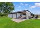Garage with four bays, golf cart parking, and boat storage on a green lawn at 4499 Highway 308, Aynor, SC 29544