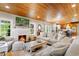 Cozy living room with a fireplace, white brick, and bright windows at 4499 Highway 308, Aynor, SC 29544