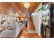 Spacious living room with wood floors, stairs to the second floor and a view into the kitchen at 4499 Highway 308, Aynor, SC 29544