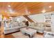 Spacious living room featuring a piano, wooden floors, and a connecting kitchen at 4499 Highway 308, Aynor, SC 29544