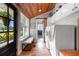 Bright mud room with wooden ceiling, bench, laundry and view to the exterior at 4499 Highway 308, Aynor, SC 29544