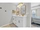 Elegant bathroom featuring double vanity sinks with sleek gold hardware and updated fixtures at 4501 Farm Lake Dr., Myrtle Beach, SC 29579