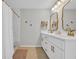 Bathroom with double vanity, gold hardware, and tiled walk-in shower; elegant and modern at 4501 Farm Lake Dr., Myrtle Beach, SC 29579