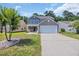 Charming two-story home featuring a two-car garage, and a beautifully landscaped front yard at 4501 Farm Lake Dr., Myrtle Beach, SC 29579