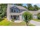 Charming two-story home featuring a two-car garage, and a beautifully landscaped front yard at 4501 Farm Lake Dr., Myrtle Beach, SC 29579