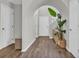 Bright foyer featuring a wood-look floor, decor, and multiple doorways at 4501 Farm Lake Dr., Myrtle Beach, SC 29579