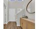 Bright foyer featuring a wood-look floor, decor, and a staircase with neutral paint at 4501 Farm Lake Dr., Myrtle Beach, SC 29579