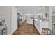 Spacious kitchen with an extended island, stainless appliances, modern finishes, and wood-look flooring at 4501 Farm Lake Dr., Myrtle Beach, SC 29579