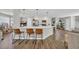 Stylish kitchen featuring a large island with bar seating, white cabinets, and stainless steel appliances at 4501 Farm Lake Dr., Myrtle Beach, SC 29579