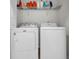 Laundry room with a side by side washer and dryer set and a storage shelf above at 4501 Farm Lake Dr., Myrtle Beach, SC 29579