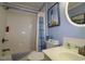 Well-lit bathroom features a shower-tub combo, a vanity sink, and coastal-themed decor at 513 Westham Dr., Murrells Inlet, SC 29576