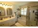 Relaxing bathroom featuring a soaking tub, stand up shower, double vanity, and lots of storage at 513 Westham Dr., Murrells Inlet, SC 29576
