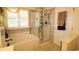 Bright bathroom showcasing a shower, soaking tub, neutral paint, and granite counters at 513 Westham Dr., Murrells Inlet, SC 29576