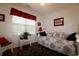 Comfortable bedroom with natural light, featuring a daybed and a spacious closet at 513 Westham Dr., Murrells Inlet, SC 29576