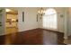 Dining room with hardwood floors, elegant lighting, and a view of the kitchen at 513 Westham Dr., Murrells Inlet, SC 29576
