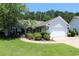 Charming single-story home with manicured lawn, featuring a two-car garage and attractive landscaping at 513 Westham Dr., Murrells Inlet, SC 29576