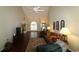 Bright living room with vaulted ceiling, hardwood floors, and large windows at 513 Westham Dr., Murrells Inlet, SC 29576
