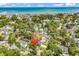 A serene aerial view of the ocean, neighborhood, and house marked with a location pin at 514 6Th Ave. S, Surfside Beach, SC 29575