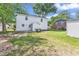 Large backyard with a grass lawn and back entrance at 514 6Th Ave. S, Surfside Beach, SC 29575