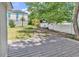 Fenced backyard featuring a wooden deck and mature trees at 514 6Th Ave. S, Surfside Beach, SC 29575