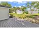Fenced backyard with a shed, palm trees, and a wooden deck at 514 6Th Ave. S, Surfside Beach, SC 29575