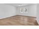 Spacious bedroom with light-colored hardwood floors and multiple windows at 514 6Th Ave. S, Surfside Beach, SC 29575