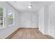 Spacious bedroom with lots of natural light, featuring two windows and multiple doors at 514 6Th Ave. S, Surfside Beach, SC 29575