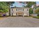 Charming two-story home with a gravel drive and welcoming entrance at 514 6Th Ave. S, Surfside Beach, SC 29575