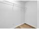 Simple walk-in closet with wood-look flooring and metal shelving at 514 6Th Ave. S, Surfside Beach, SC 29575