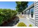 Private backyard with mature landscaping and decorative lattice, and exterior access to the home at 578 Circle Dr., Myrtle Beach, SC 29575