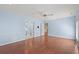 Large bedroom with blue walls and hardwood floors, features entrances to other rooms at 578 Circle Dr., Myrtle Beach, SC 29575