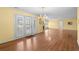 Dining area featuring laminate floors, elegant chandelier, and access to the outdoor patio at 578 Circle Dr., Myrtle Beach, SC 29575