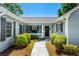 Inviting front entrance with a walkway, landscaped bushes and a welcoming black front door at 578 Circle Dr., Myrtle Beach, SC 29575