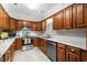 The eat-in kitchen offers wood cabinets, stainless steel appliances, and marble countertops at 578 Circle Dr., Myrtle Beach, SC 29575